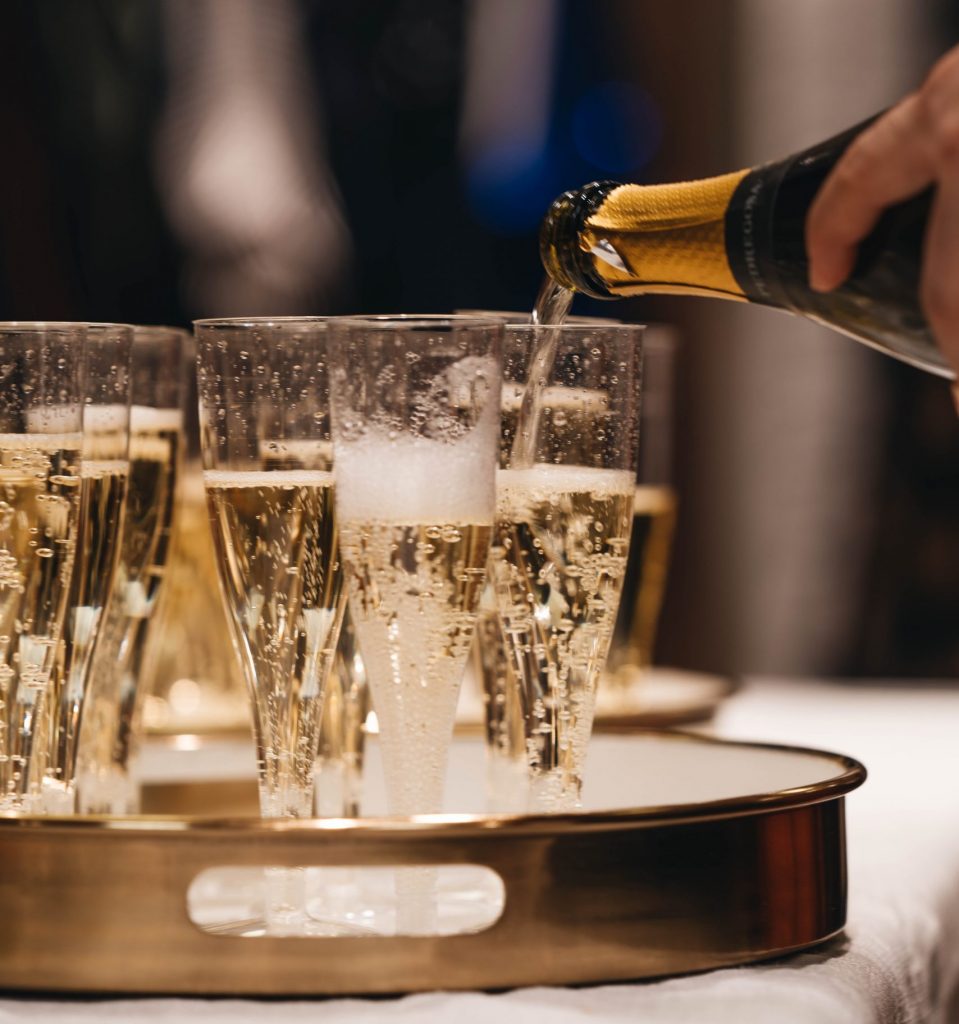 champagne pouring into flutes