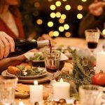 pouring red wine at a holiday dinner