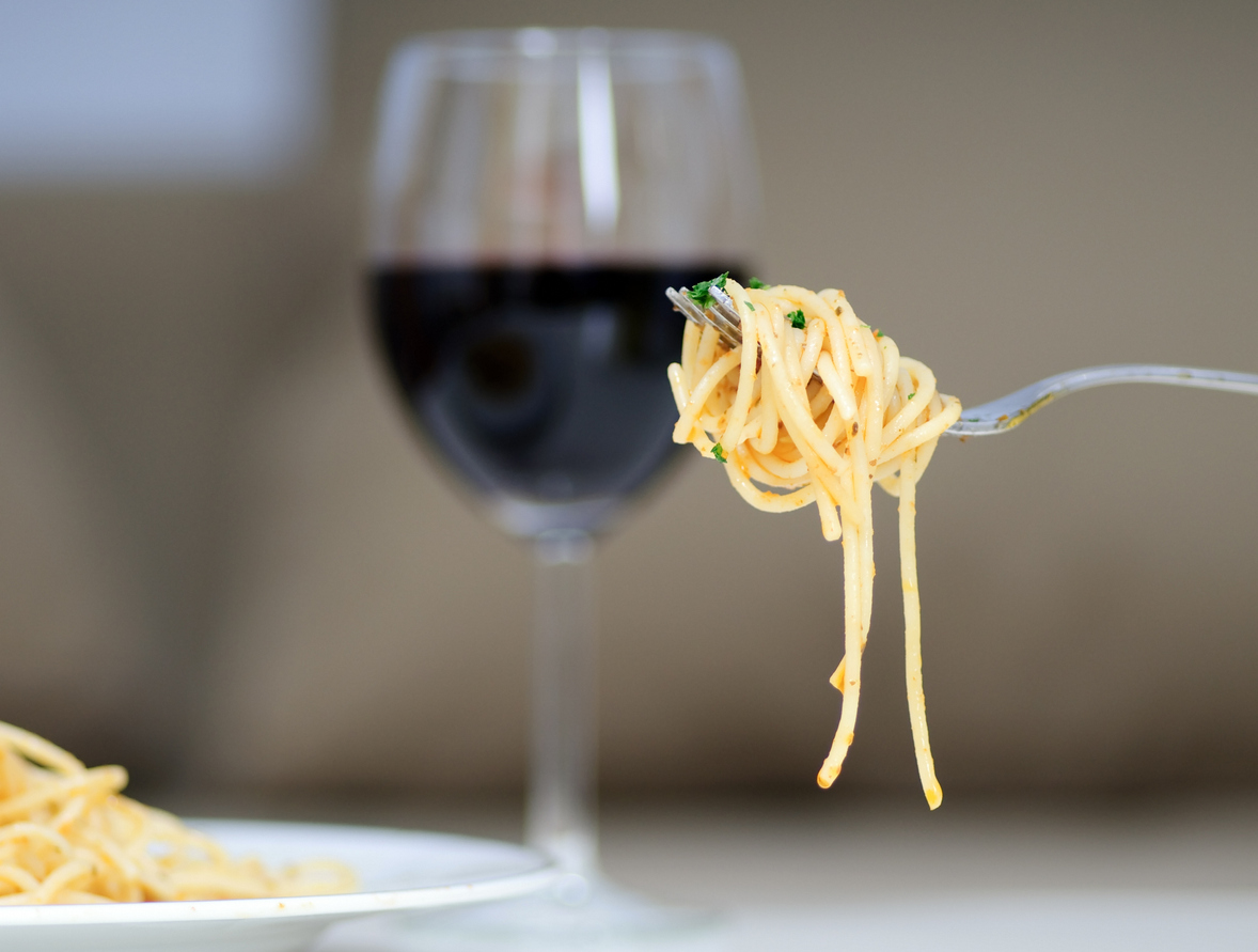 Perfect pasta twirl with a glass of red wine